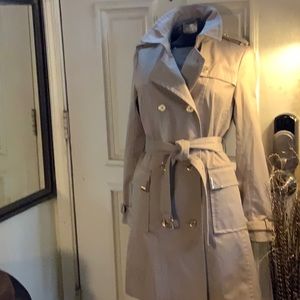 Michael Kori’s double-breasted trench coat with gold detail